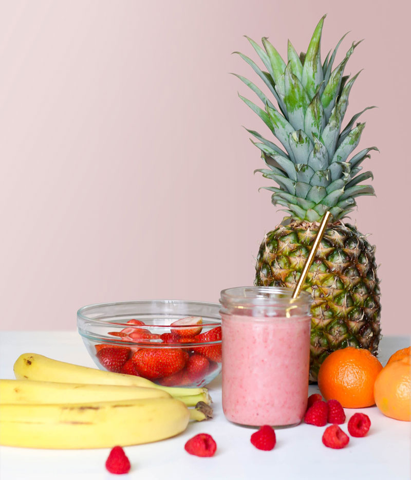 Various fruits and a glass of juice